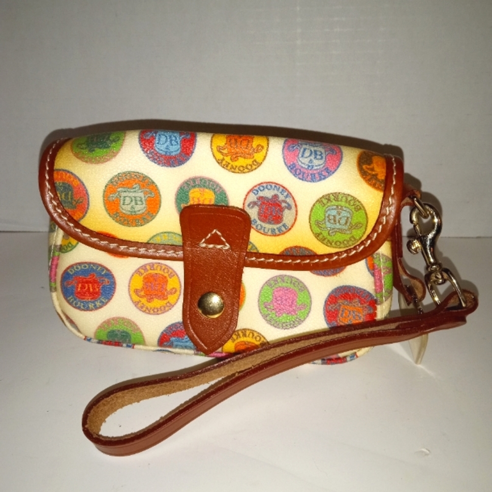 Dooney & Bourke Vtg Coated Canvas Medallion Wristlet.  13